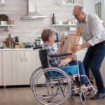 Elderly man helping woman with shopping