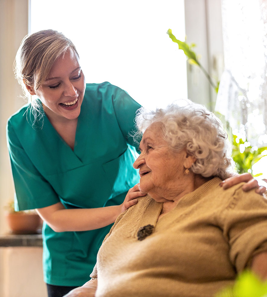 Friendly careworker supporting an elderly lady