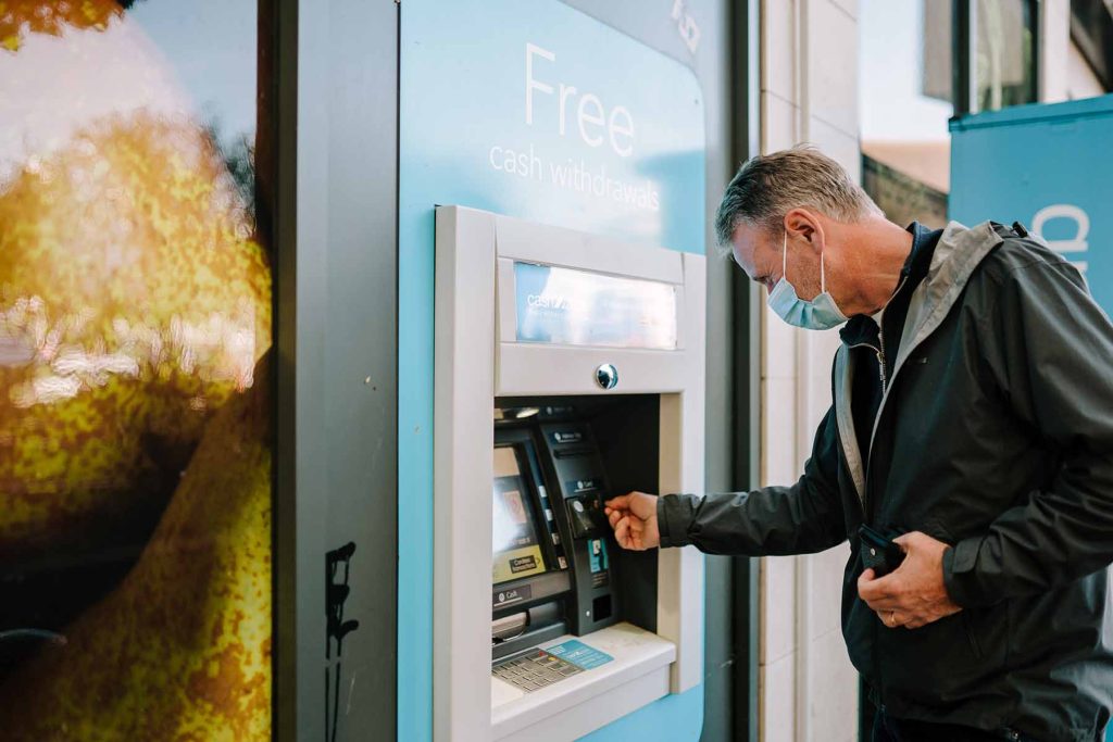 Older person using ATM