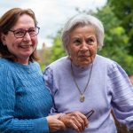 middle-aged person helping older person