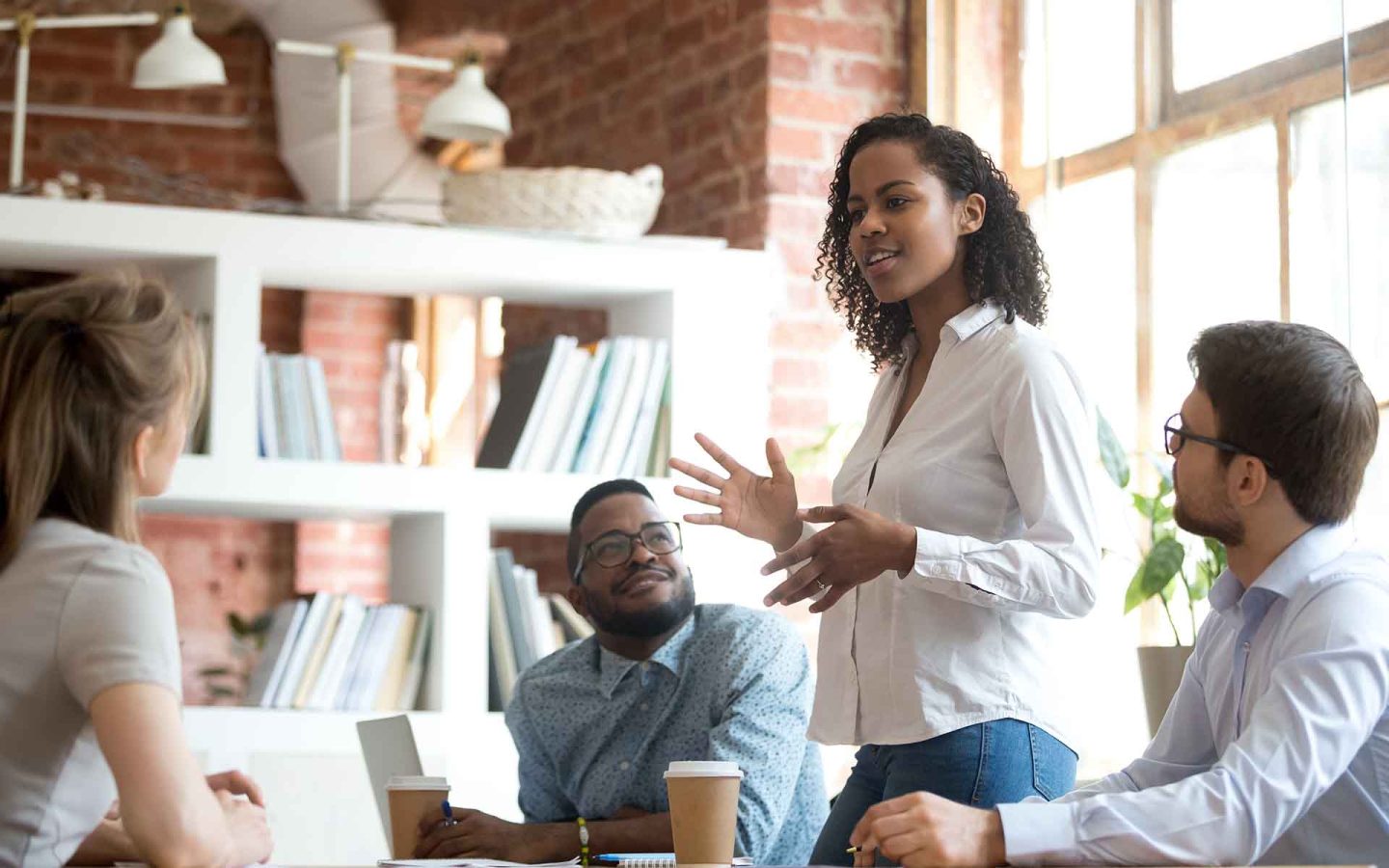 four people on a meeting